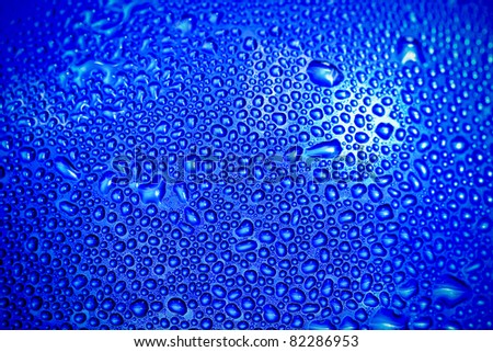 water dew drops on blue wall