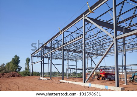 Work site and large steel frame of a large commercial building.