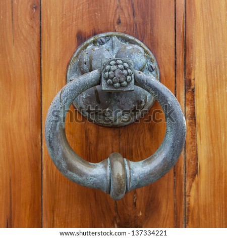 Antique door pull or door knocker on the front cedar door of St. Peter\'s Anglican Church, in St. George\'s, Bermuda.