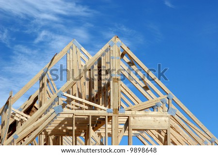 Wooden rafters of a new home under construction.