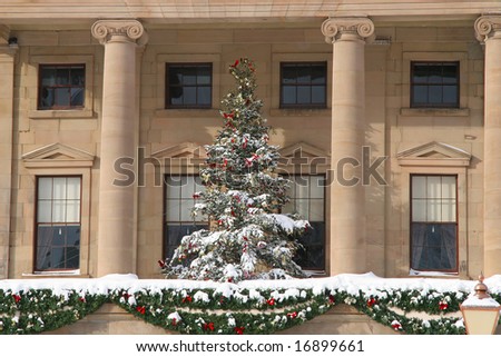 Christmas tree and decorations plus  lots of snow on Province House in Charlottetown, Prince Edward Island, Canada.