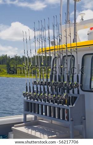 A rack of fishing rods on a tourism deep sea fishing vessel on the north shore of Prince Edward Island, Canada.