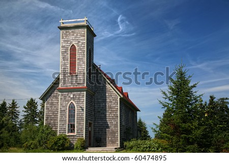 An old traditional style wooden church in rural Prince Edward Island.  Once a Church of Scotland but now unused.