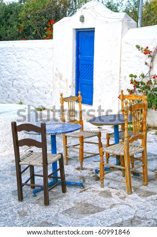 An abandoned outside restaurant seating area offseason on Mykonos.