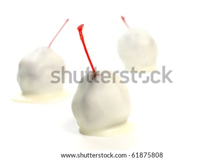 Maraschino cherries dipped in white chocolate.  Each is handmade taking care to leave the stem exposed.