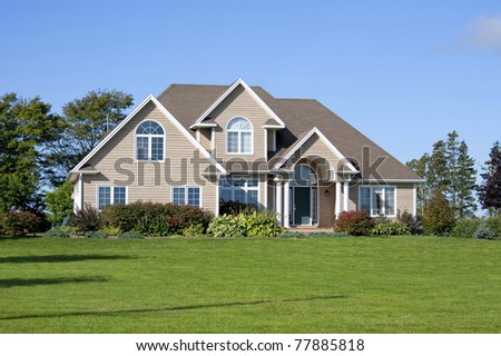 Exterior of a detached modern north American family home in a rural setting.