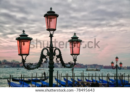 Rose colored lights along the Grand Canal in Venice, Italy at sunset.