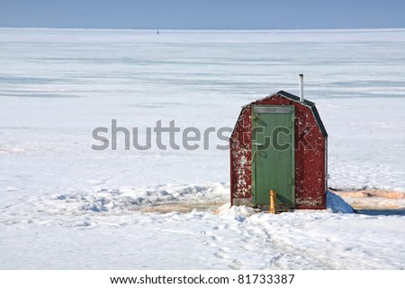 Rustic ice fishing shack out on the ice off Prince Edward Island, Canada.  Perfect for fishing smelts, a relative of mackeral.