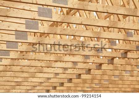 Roof rafters in the new construction of a wooden building or house.