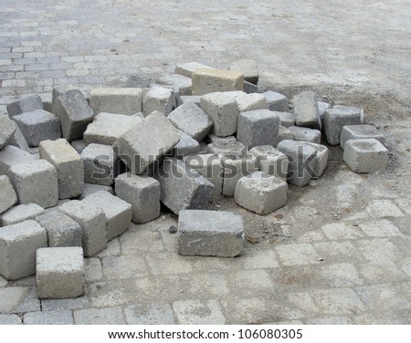 stack of cubic tile laying on pavement