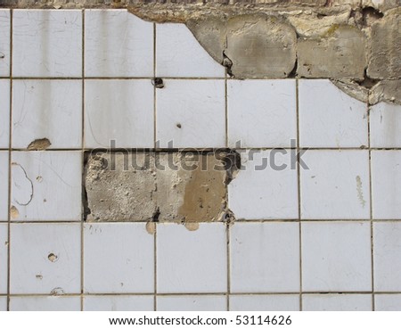 stock-photo-damaged-white-tile-wall-with-some-tiles-missing-53114626.jpg