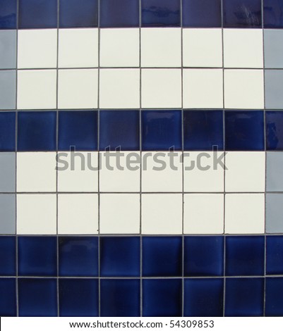 blue gray white tile pattern on a wall