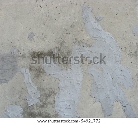 concrete wall with a plaster cement repair