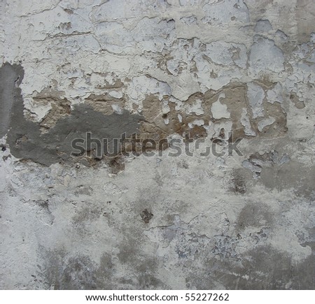 damaged gray white dirty repaired concrete wall