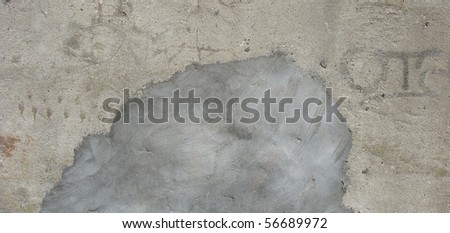 cloud like concrete repair on a dirty wall