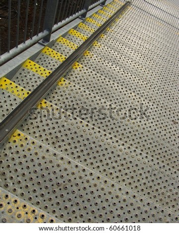 metal industrial safety steps stairs with yellow marks