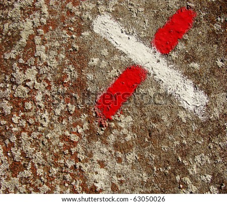 spurs and mold mould grunge surface with red and white painted cross
