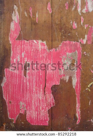 remains pink poster grunge on piece of wood timber