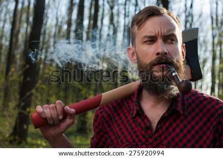 lumber jack men in forest axe hipster