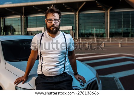 beard men hipster car parking airport terminal