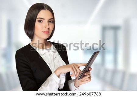 Young beautiful business woman holding talks with business partners via the Internet in your office