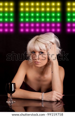 Portrait of the young girl having a rest at restaurant, cafe, a bar