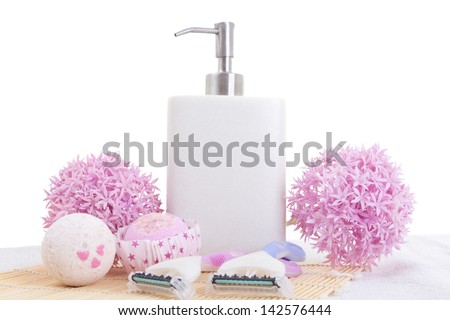 disposable razors, soap and flowers over white