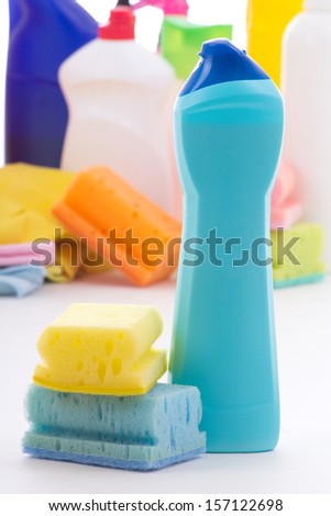 plastic bottle, cleaning sponges and gloves isolated on white background