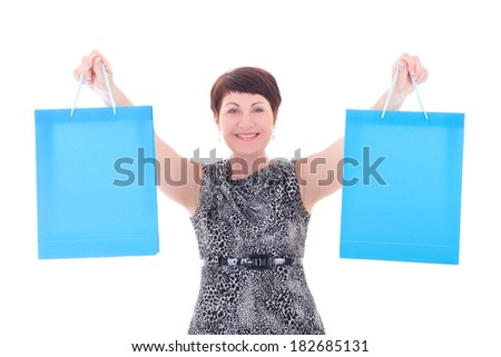 happy elder woman with shopping bags isolated on white background