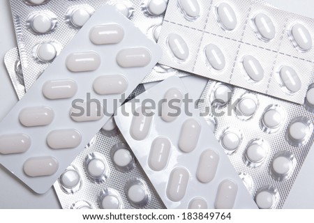 close up of pills and capsules in blister packs