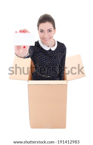 business woman showing visiting card and standing in cardboard box isolated on white background