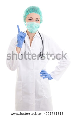 young woman doctor in surgeon mask, cap and rubber gloves isolated on white background