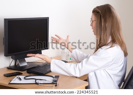 stressed young woman doctor in her office