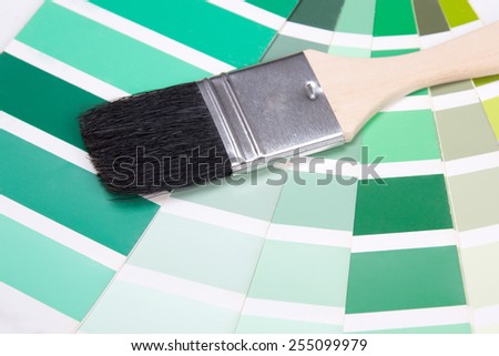 interior design - paint brush and colorful paper palette with vivid colors