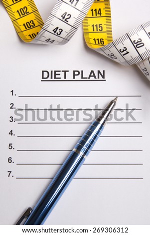 paper with blank diet plan, pen and yellow measure tape