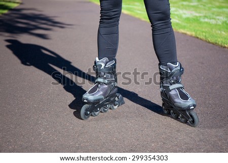 close up view of slim legs in roller blades