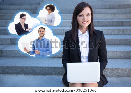 internet commerce concept - beautiful business woman sitting on stairs with laptop and clouds with business people