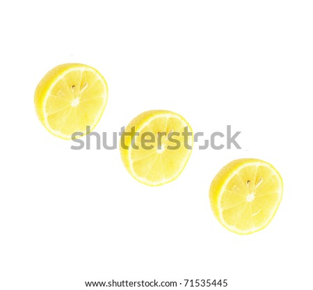 Single cross section of lemon. Isolated on white background. Studio photography.