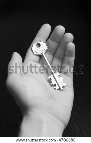 silver key on hand. B/W