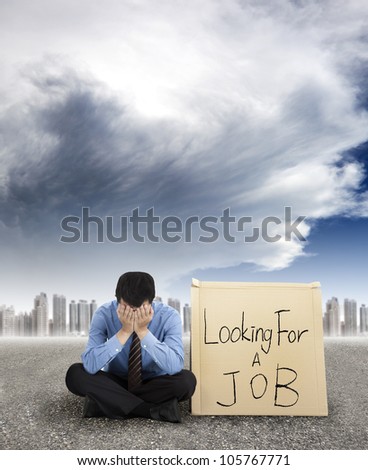 businessman looking for a job and city with storm coming