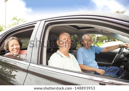 happy seniors enjoying road trip and travel