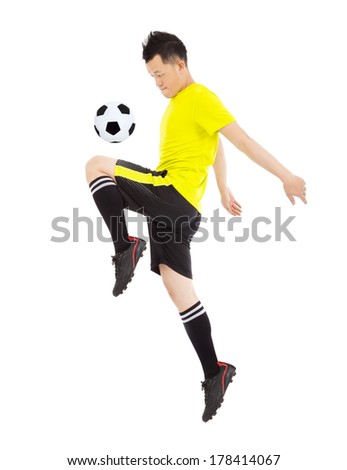 soccer player jumping to stop the ball