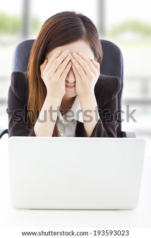 Young Business woman feel exhausted and cover her eyes