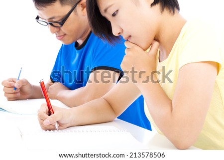 two young students learning together in classroom