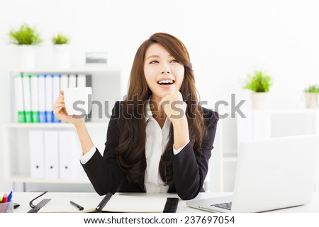 beautiful young business woman drinking coffee in office