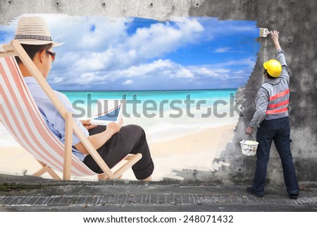 worker with paint brushes drawing business travel concept ad on the wall