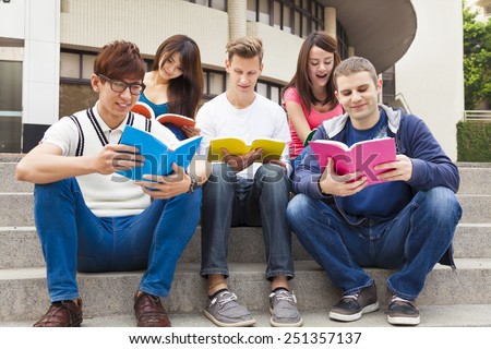 Happy  young group of students study together