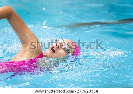 young women is swimming in the pool