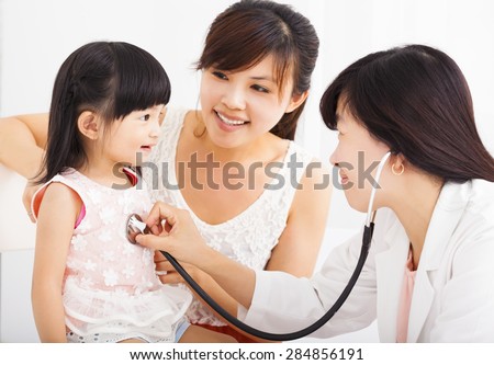 happy Little girl and young  in hospital having examination