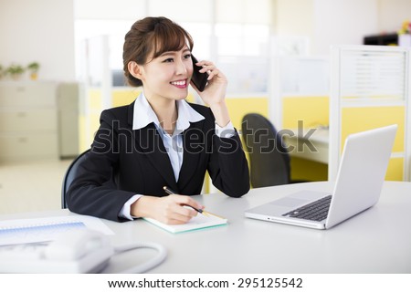 businesswoman talking on the phone in the office